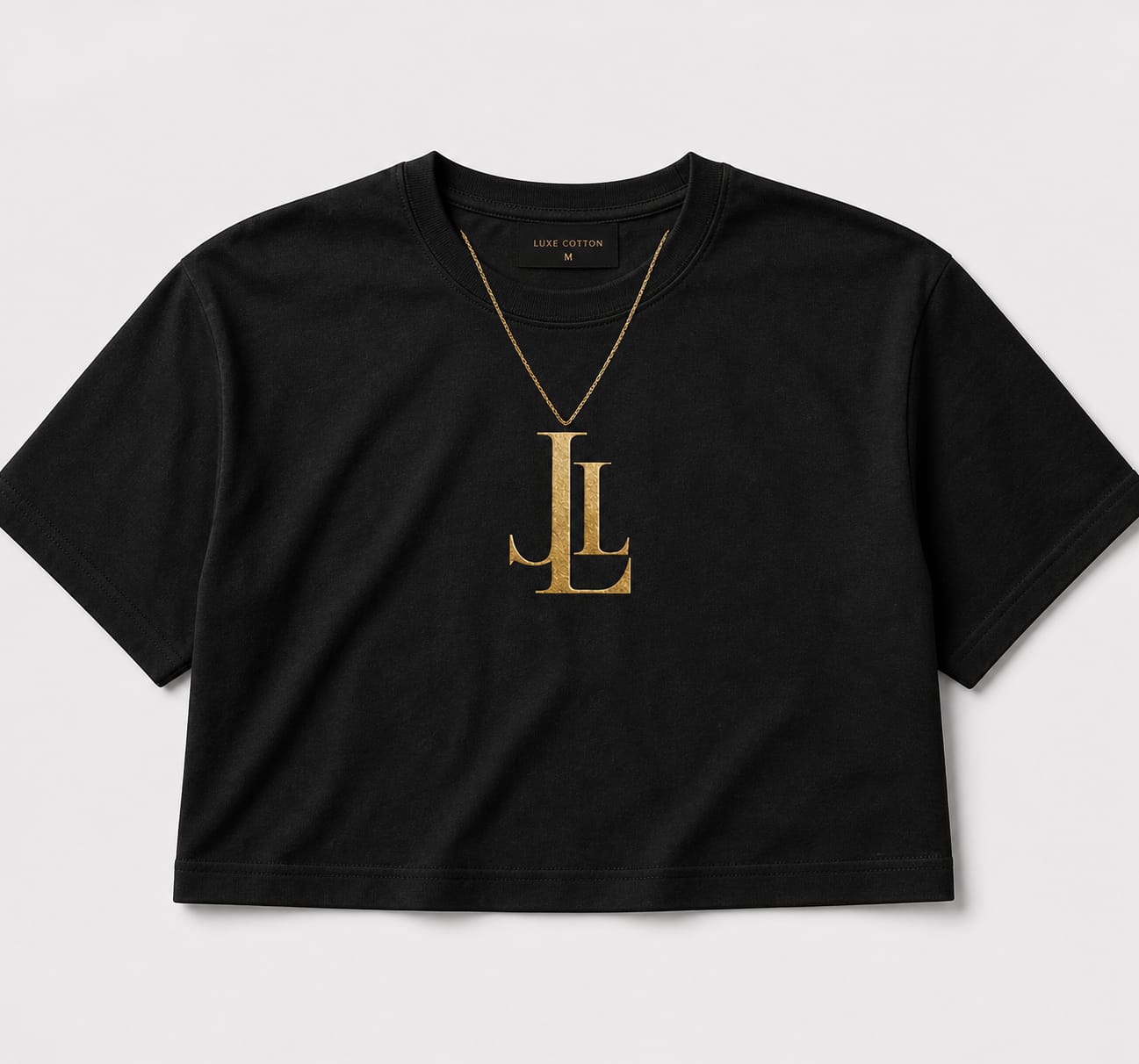 The Cropped (Chain) — gold LL pendant printed on heavyweight black cotton